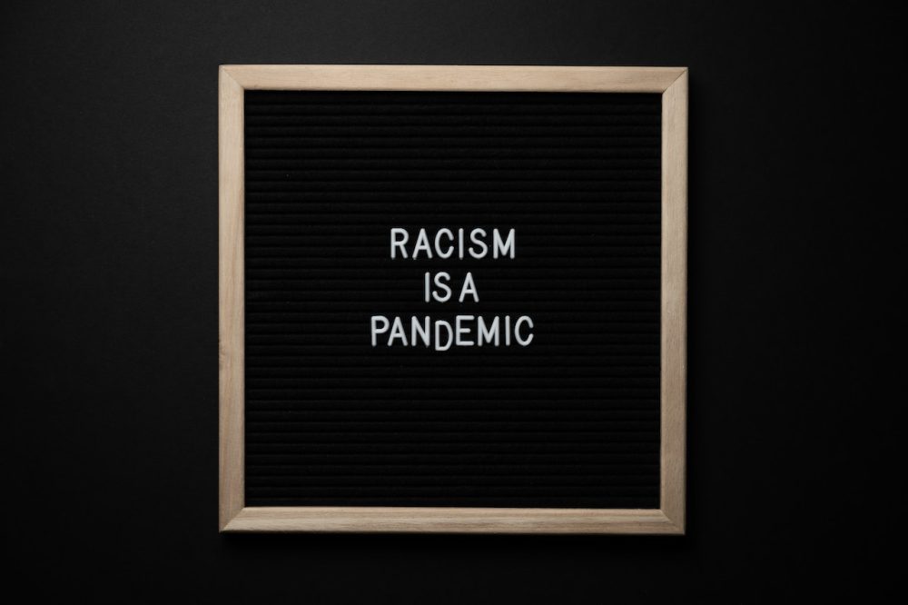 racism is a pandemic sign